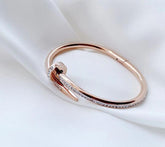 Bratara placata cu aur in forma de cui - Deloria